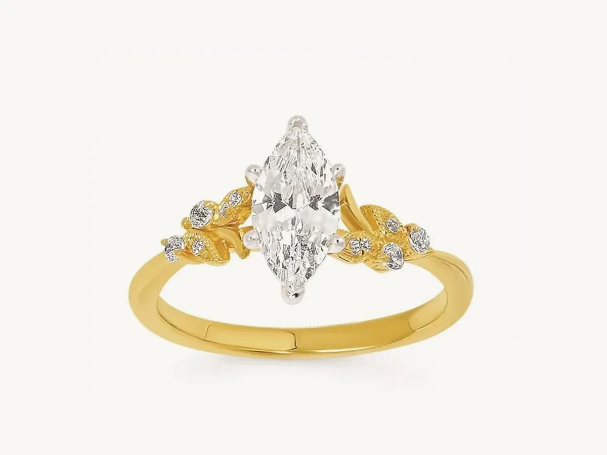Gold ring with marquise diamond and leaf design. Click to view complete rings.