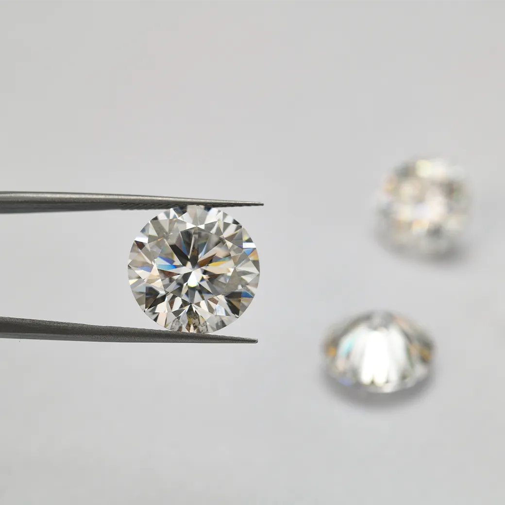 A princess-cut diamond ring with a twisted band on a reflective surface.
