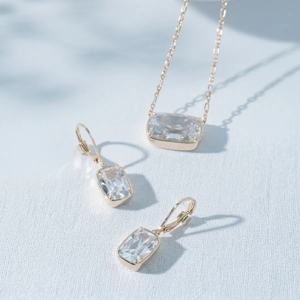 Lab-grown diamond necklace and earrings set on a light surface at Georgetown Jewelers, Wood Dale, IL.