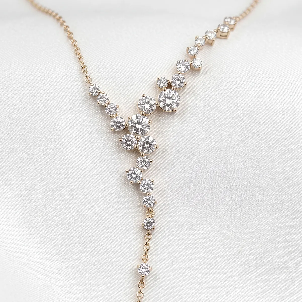Diamond necklace with floral design on a white background.