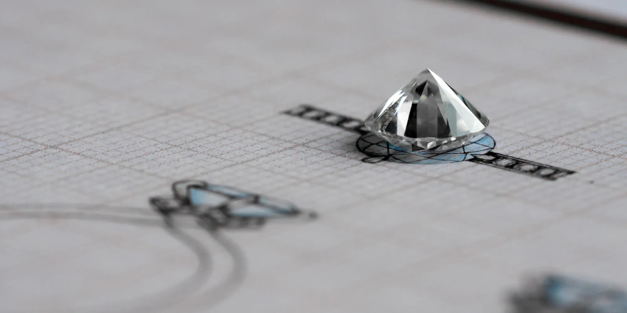 Diamond on jewelry design sketch paper, showcasing custom jewelry creation.