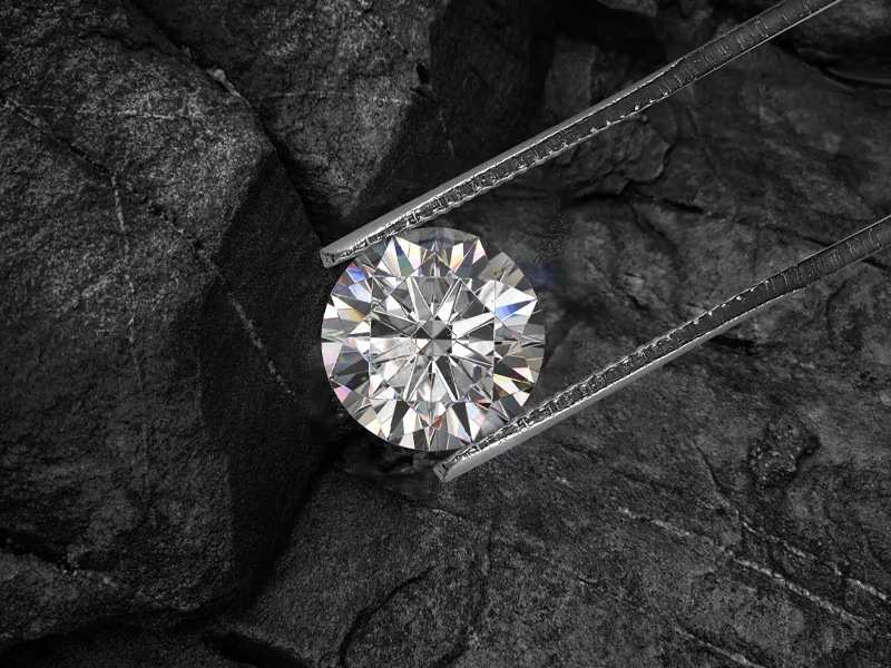 A single round diamond on a dark background, showcasing its brilliance.