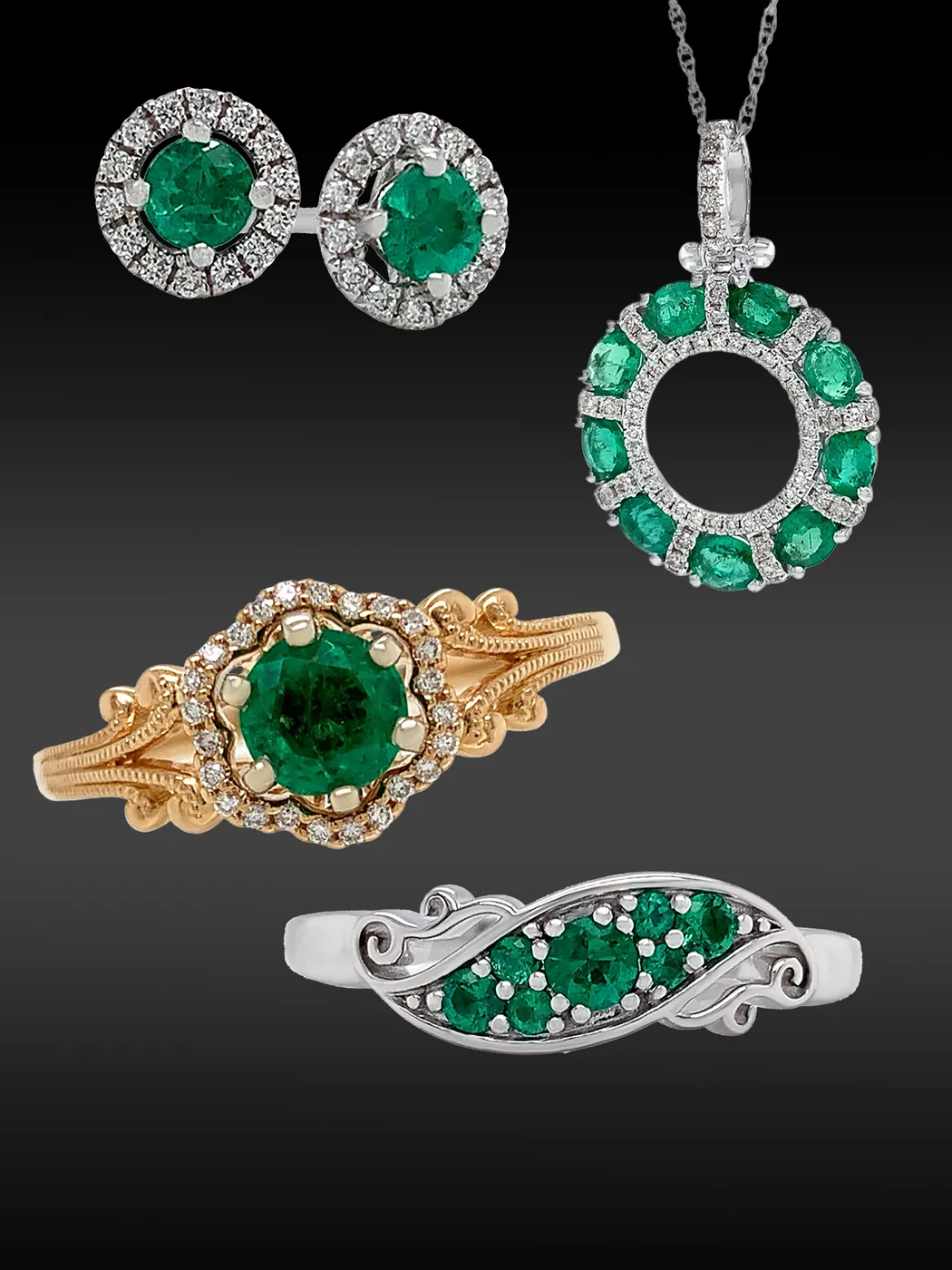 Emerald jewelry set with earrings, pendant, and rings on a dark background.