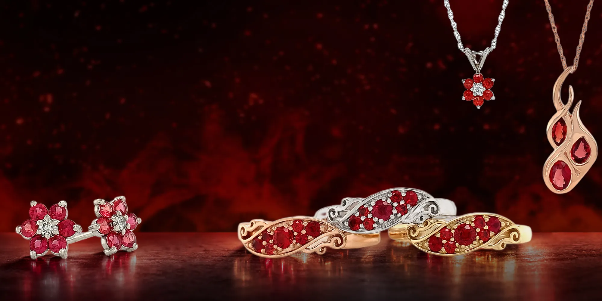 Fire ruby jewelry set against a dark background, featuring rings, earrings, and necklaces.