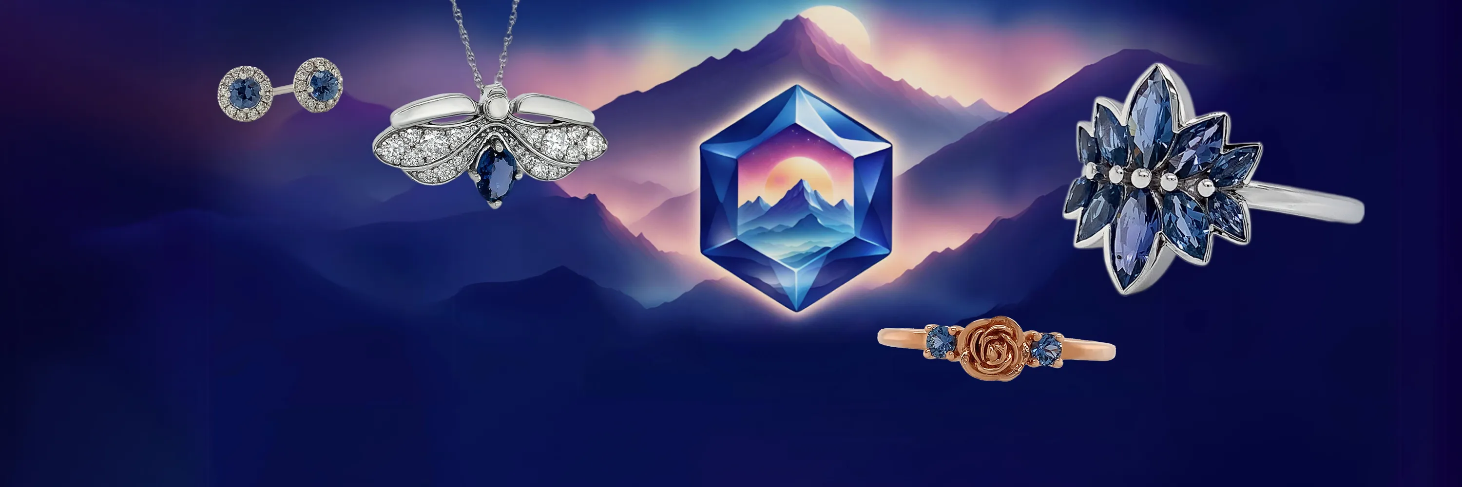 Jewelry pieces with blue sapphires on a mountain-themed background. Click to shop Yogo Sapphire Jewelry.