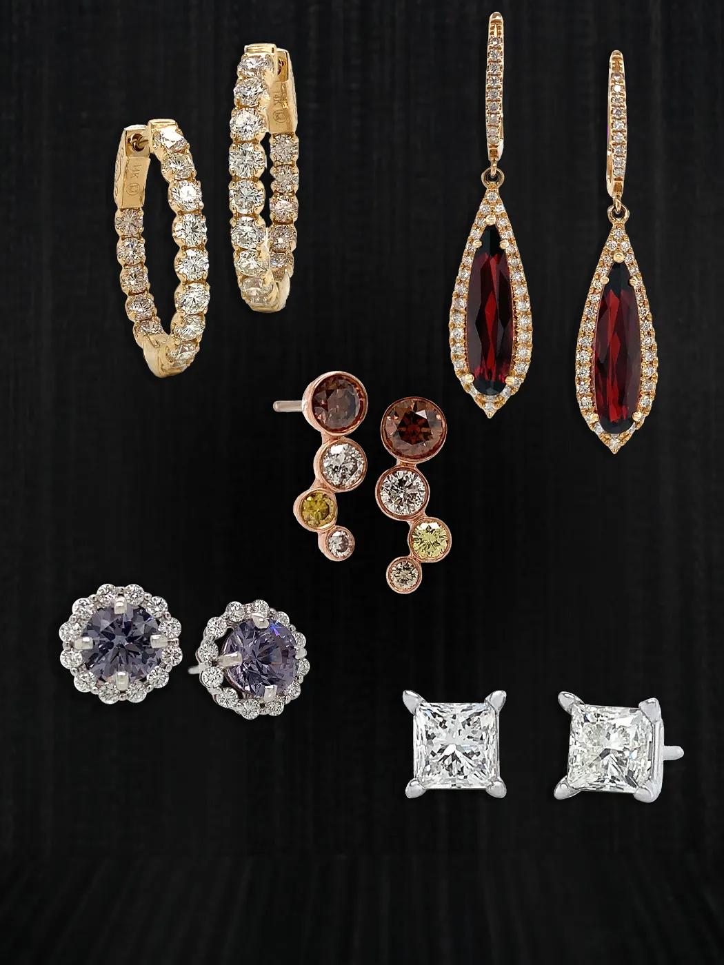 Elegant earrings displayed on a black background.