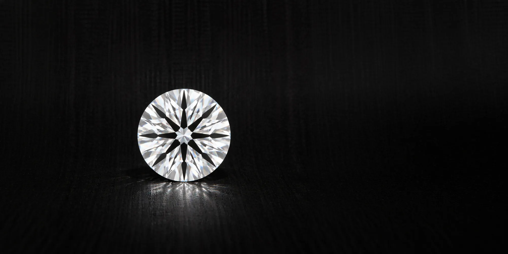 A single round diamond on a dark background, showcasing its brilliance.