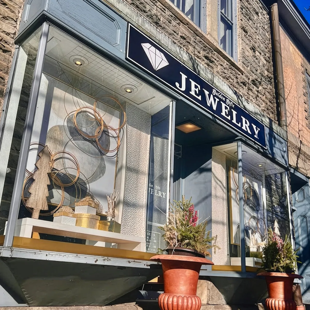 Golden Gifts Jewelry storefront in Milford, showcasing elegant jewelry displays and decorative elements.