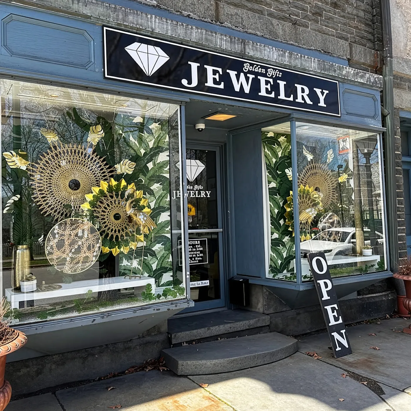 Golden Gifts Jewelry storefront with decorative windows and an 