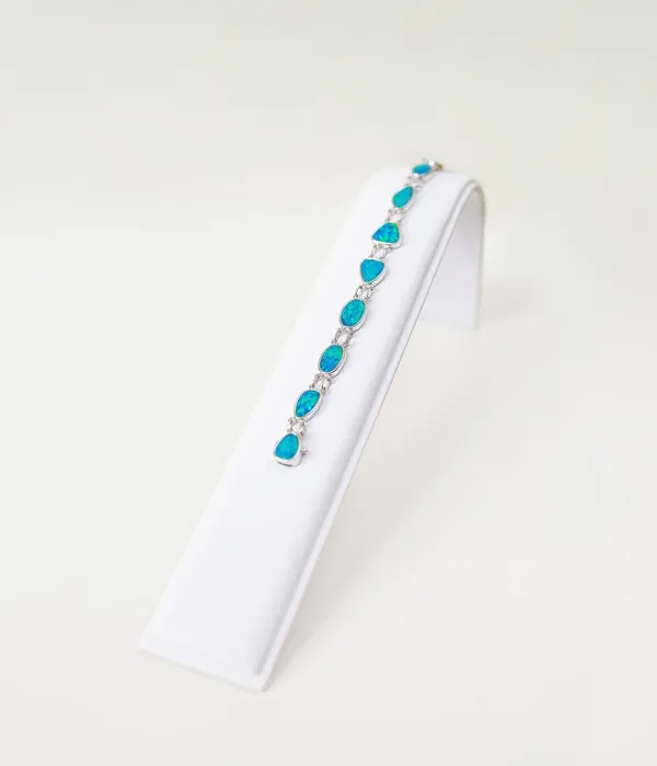  An opal bracelet like no other! These gems meld fluidly together to create a real statement piece. Grader Jewelers Groton, CT