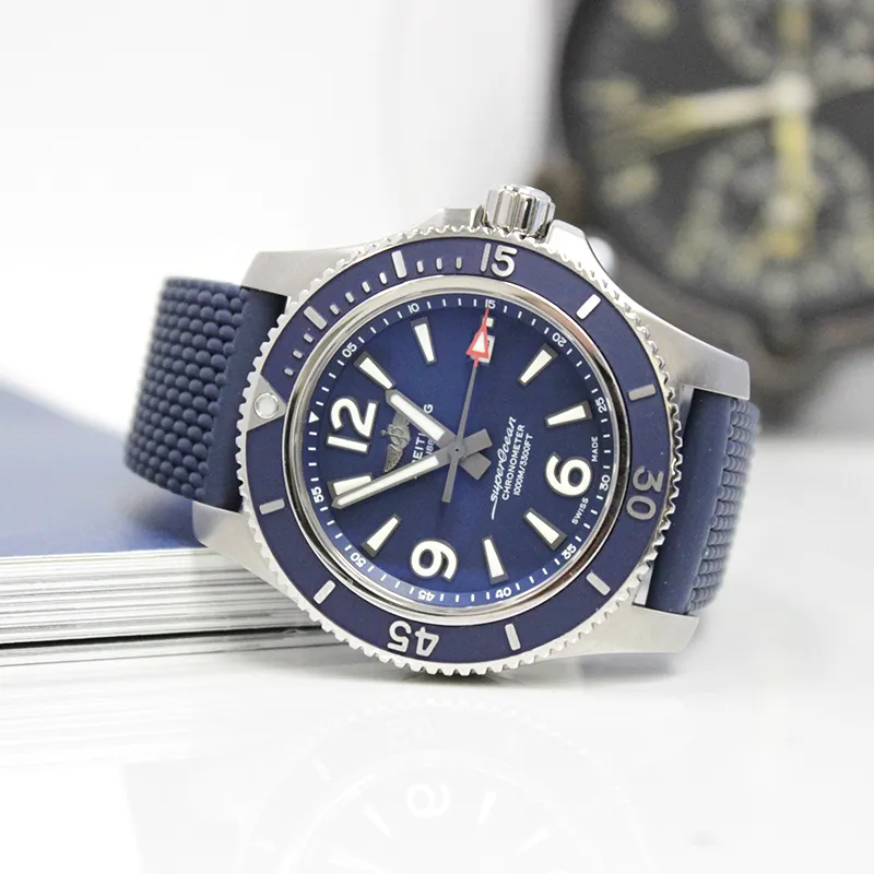 Stainless steel Breitling SuperOcean watch with navy blue dial and bezel, with rubber blue strap