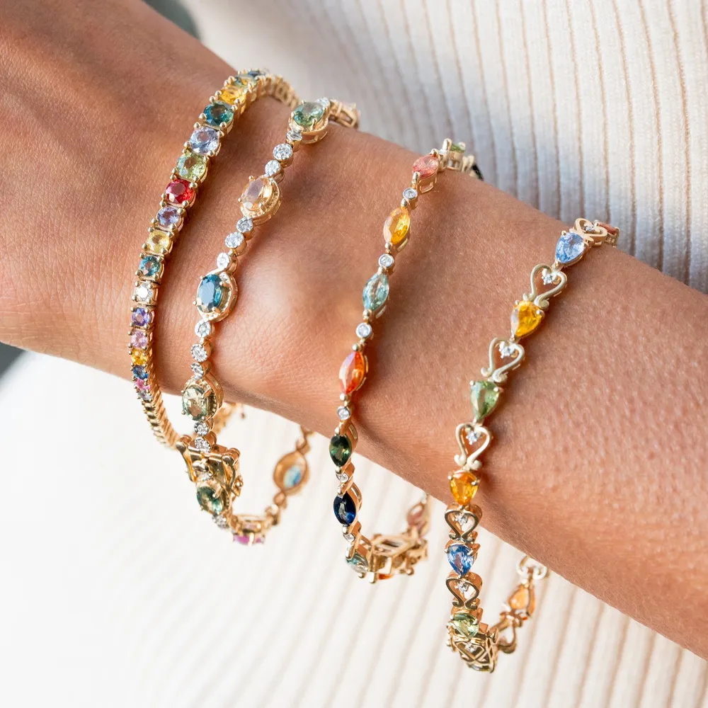 Colorful gemstone bracelets on a wrist, showcasing intricate designs.