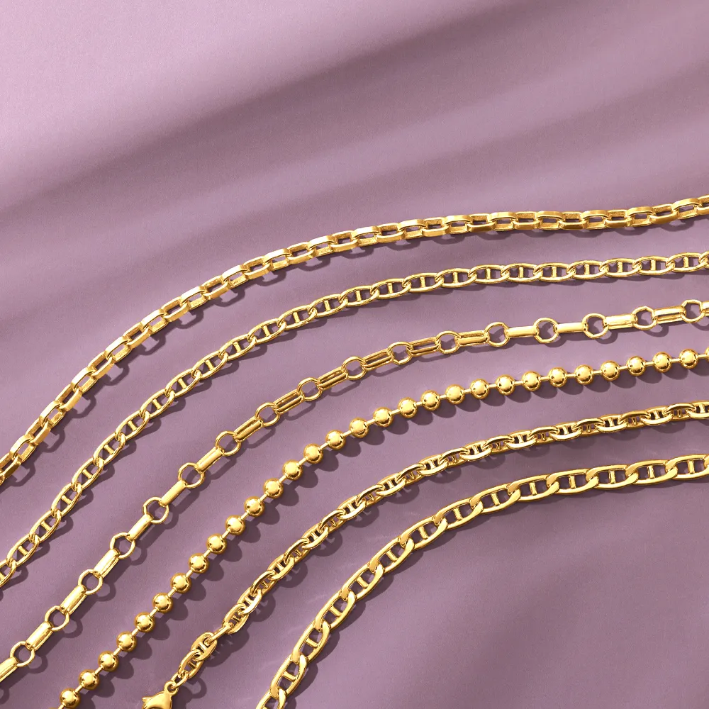 Gold chains with various link styles displayed on a purple background.