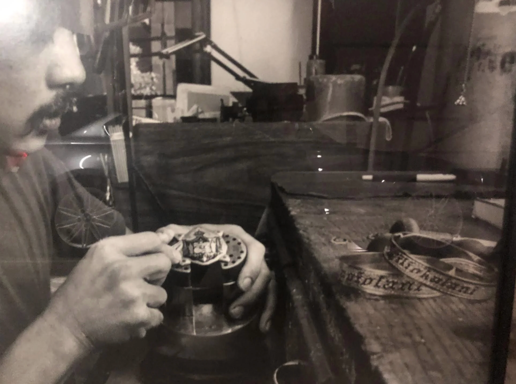 A master goldsmith etching Hawaiian crests