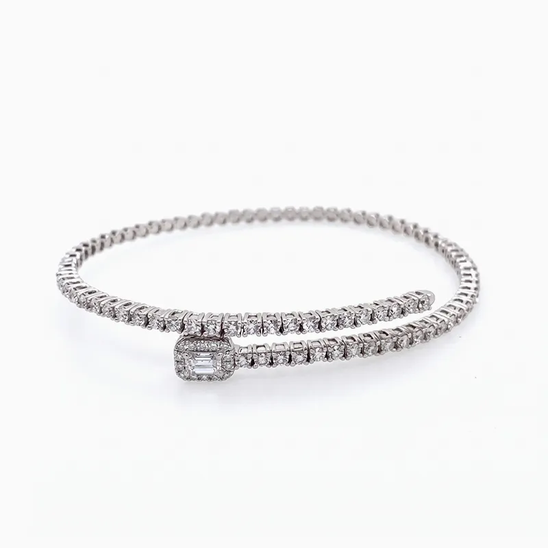 A diamond-encrusted wrap bracelet with a rectangular centerpiece on a white background.
