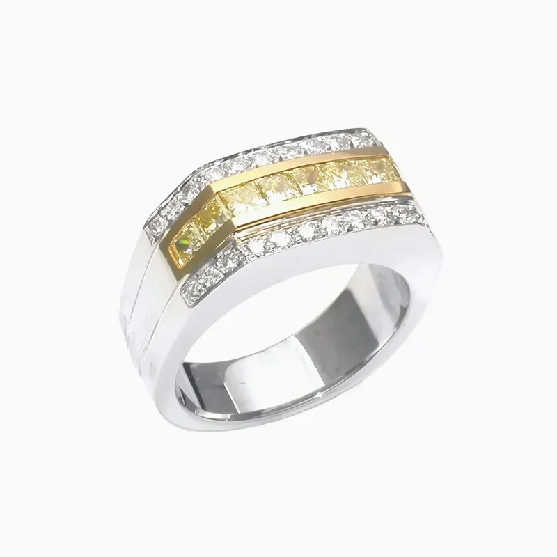 A silver ring with yellow and white diamonds in a geometric design.