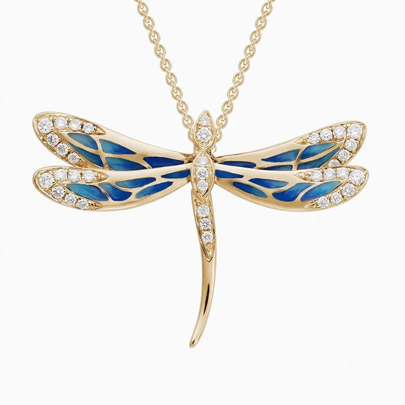 A gold dragonfly pendant with blue enamel and diamond accents on a chain.