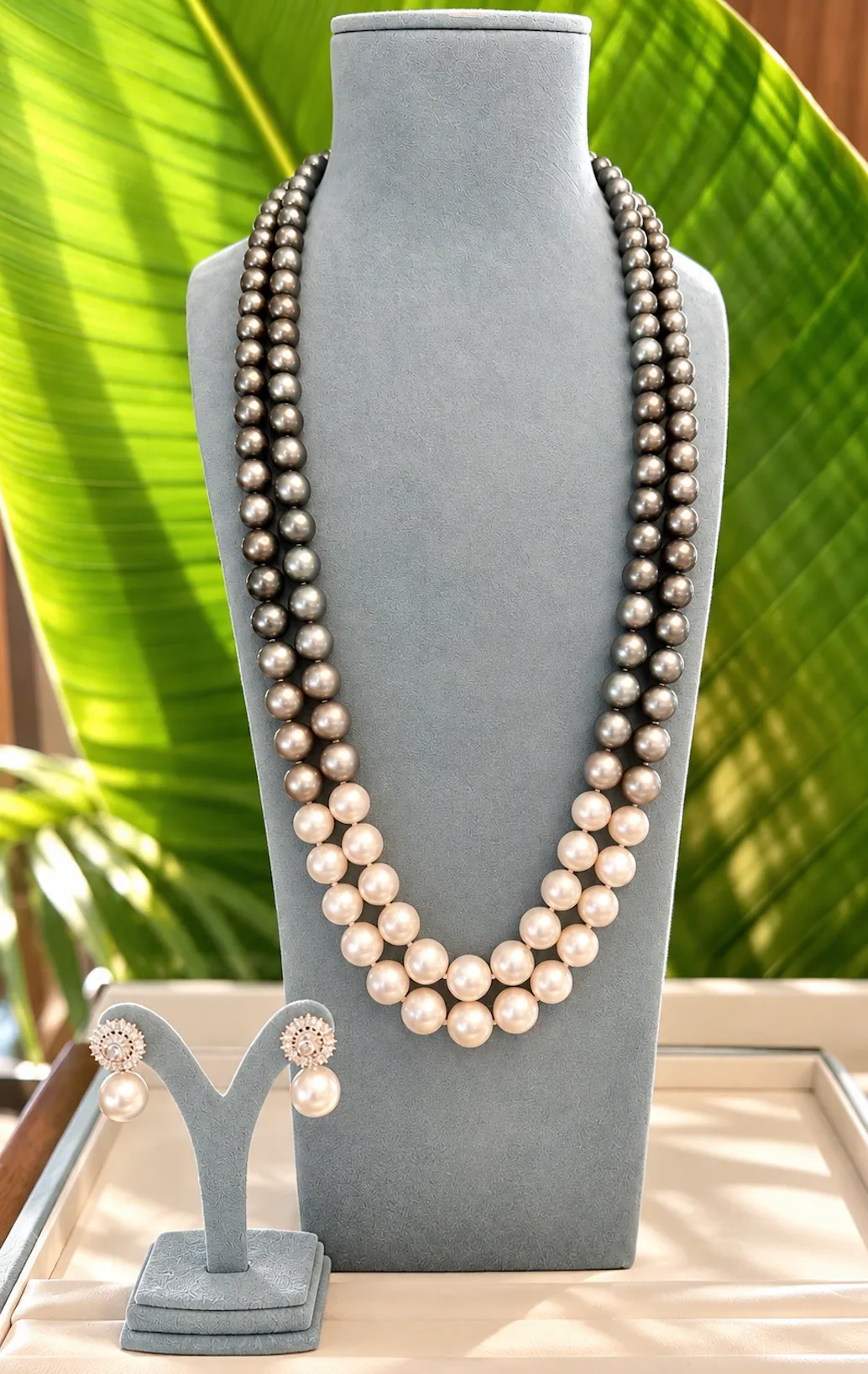 An ombre tahitian and south sea pearl necklace with south sea pearl and diamond earrings.