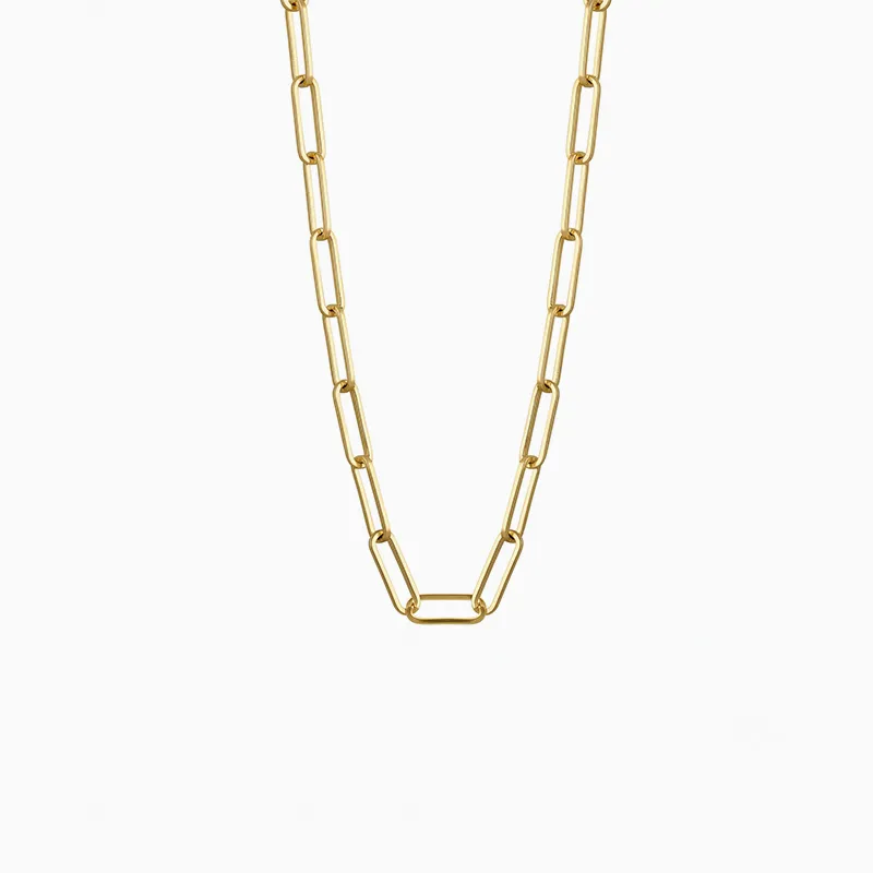 A gold chain necklace with elongated links on a white background.