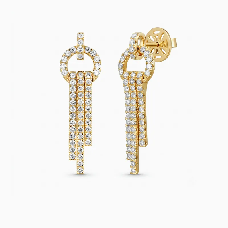 Gold and diamond drop earrings with circular and linear design.