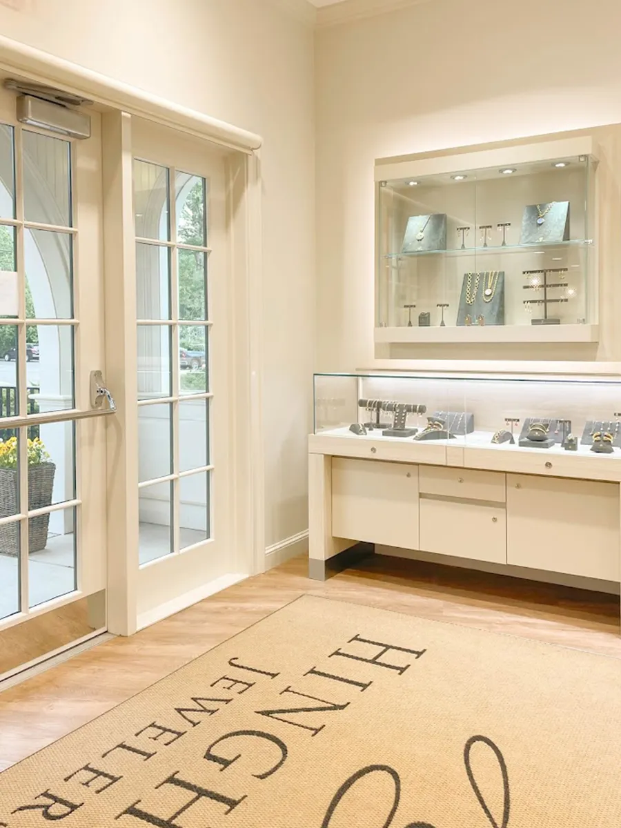 Interior of Hingham Jewelers showcasing fine jewelry displays and entrance door.