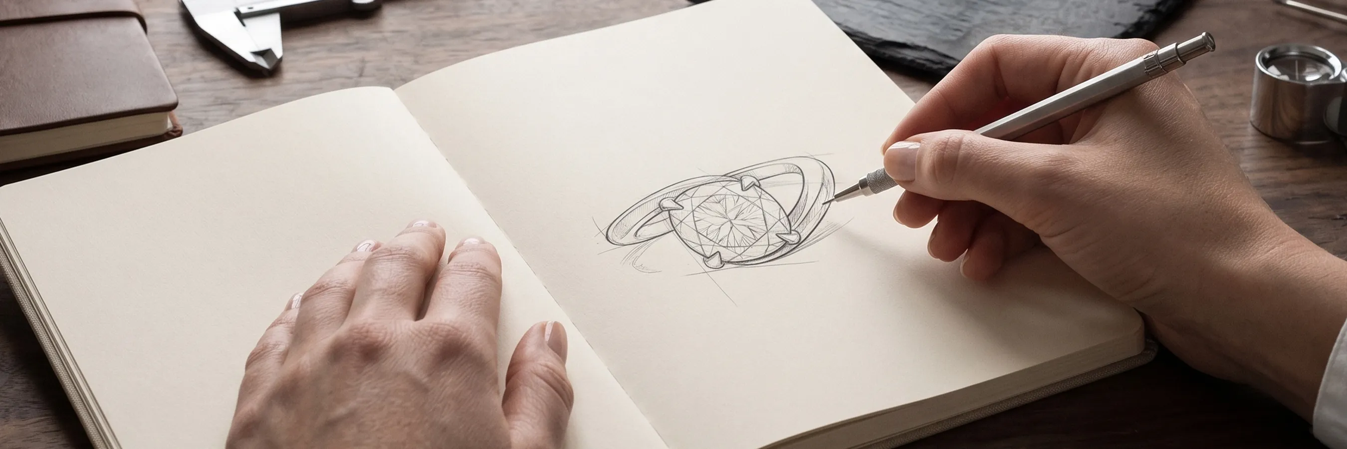 Sketch of a ring design in a notebook with a hand drawing. Start a Project at Hingham Jewelers.