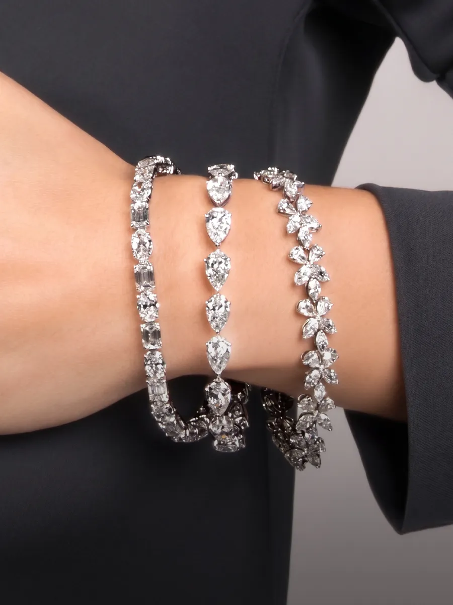 Lab grown diamond bracelets on wrist. Shop at Hingham Jewelers.