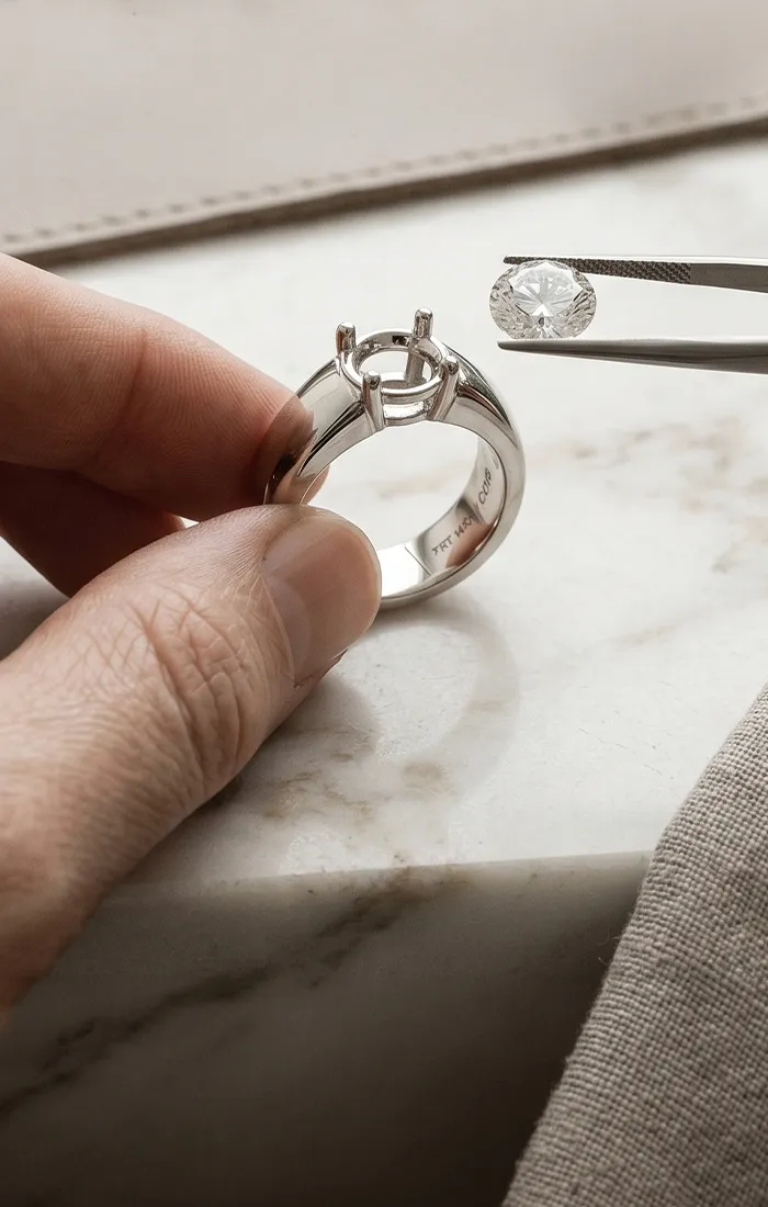Custom engagement ring design with loose diamond and ring setting at Hingham Jewelers.