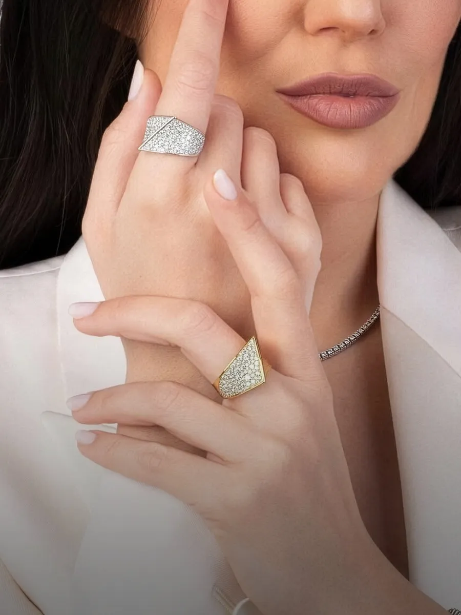 Woman showcasing diamond rings on both hands, wearing a necklace. Shop rings at Hingham Jewelers.