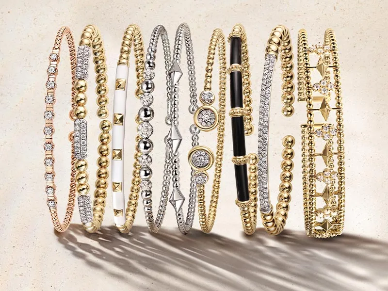 Stacked Bujukan bracelets in gold, silver, and diamond with various designs. Click to see more at Holliday Jewelry.