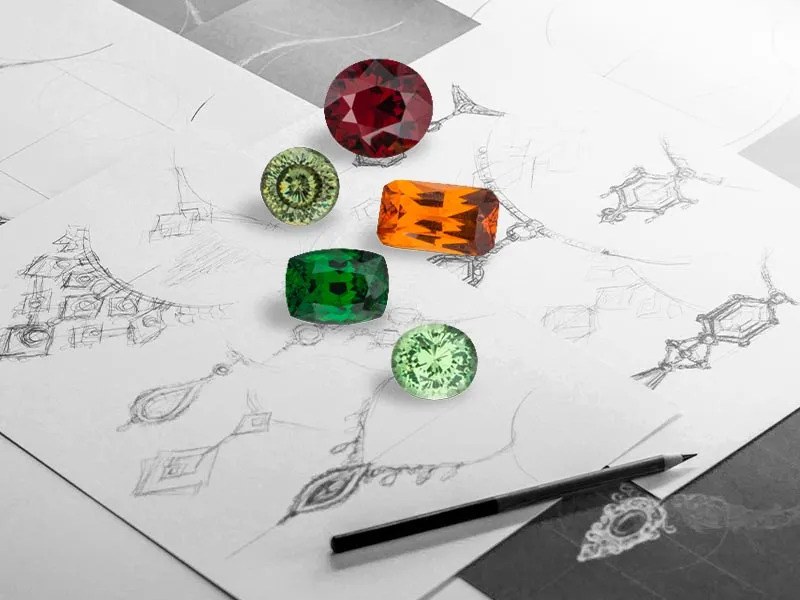 Colorful gemstones on jewelry sketches with a pencil; click to book an appointment at Holliday Jewelry in Klamath Falls.