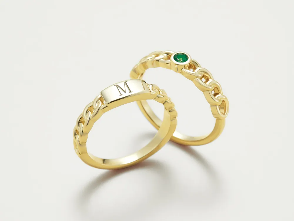 Two gold rings, one with an engraved 