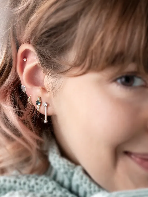 Elegant hands adorned with a diamond bracelet and rings, showcasing fine jewelry.