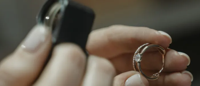 Expert assessing value in jewelry appraisal services