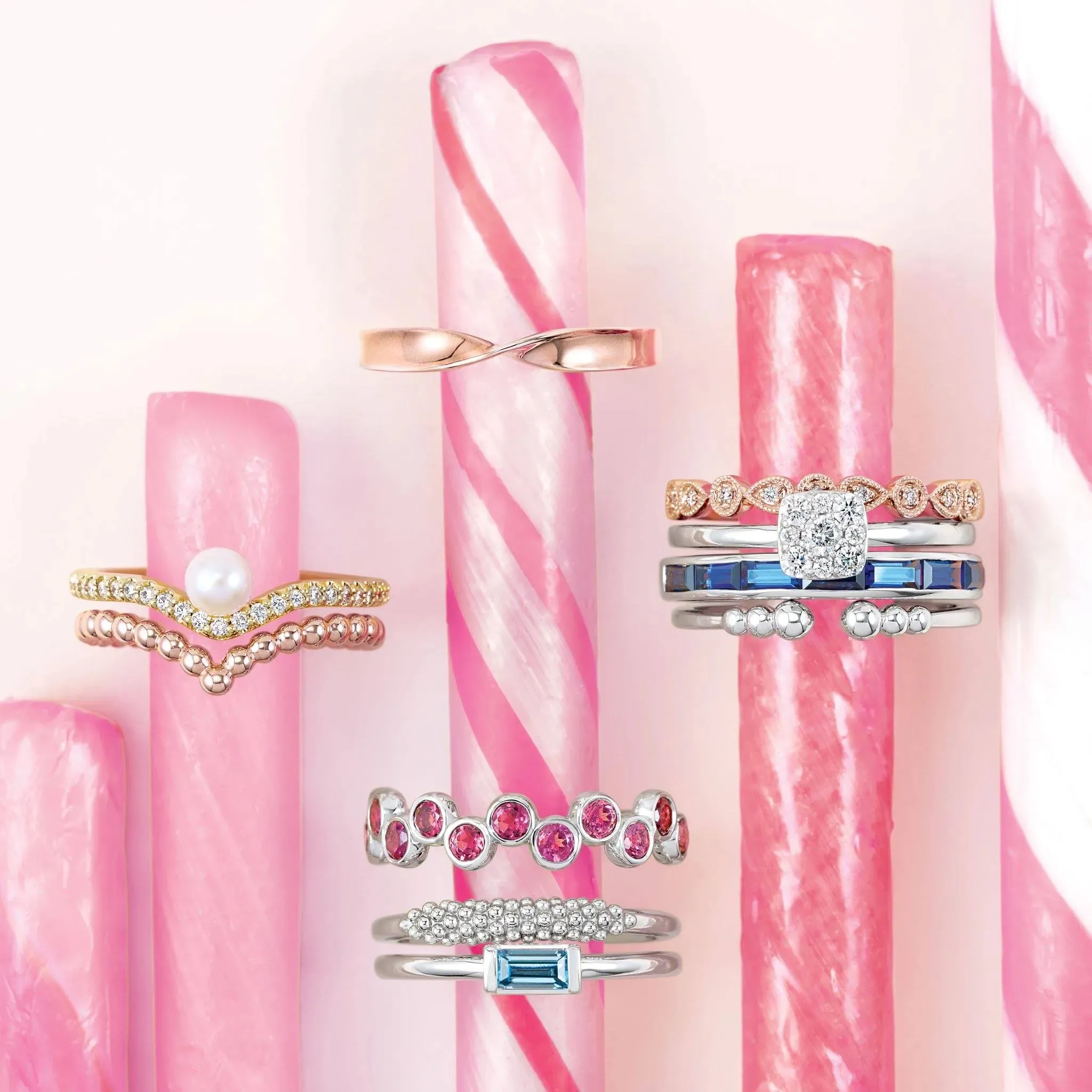 Two gold rings, one with a diamond, in a purple velvet box on red fabric.