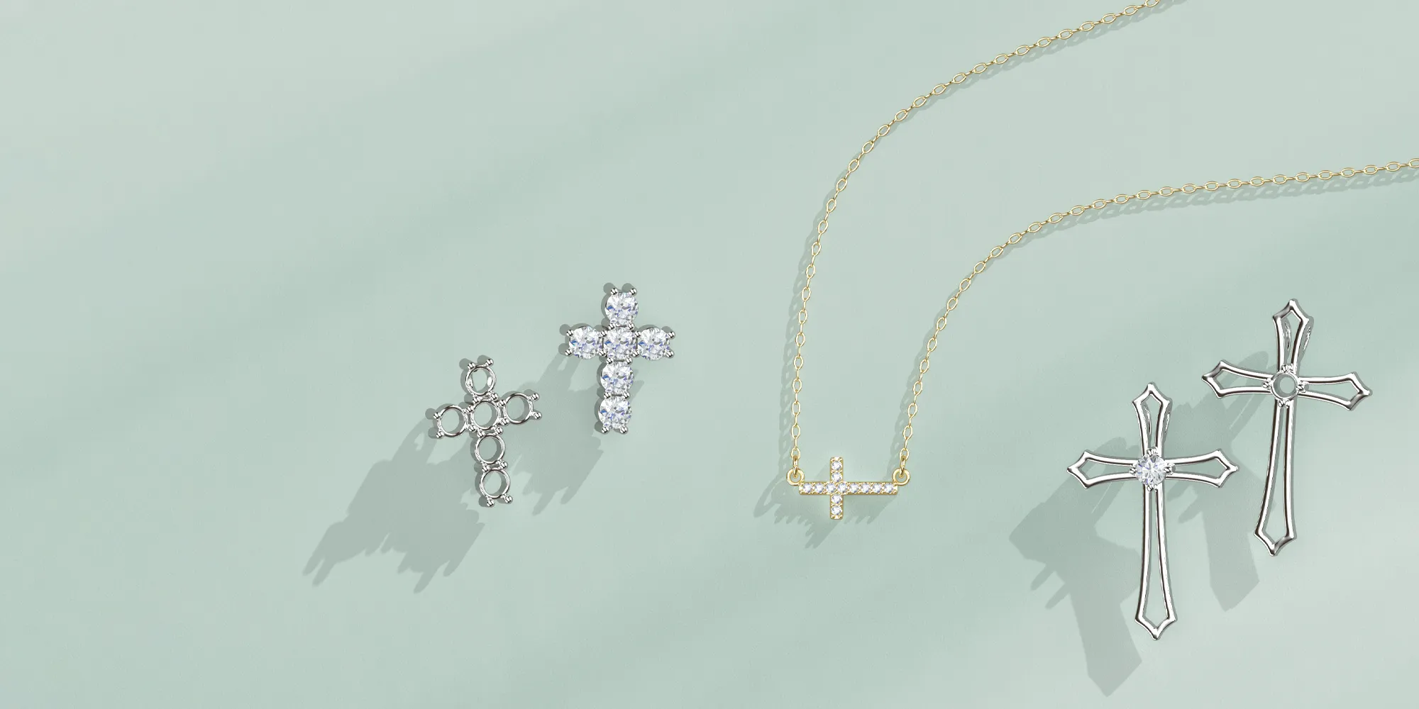 Cross-shaped jewelry pieces on a light background.