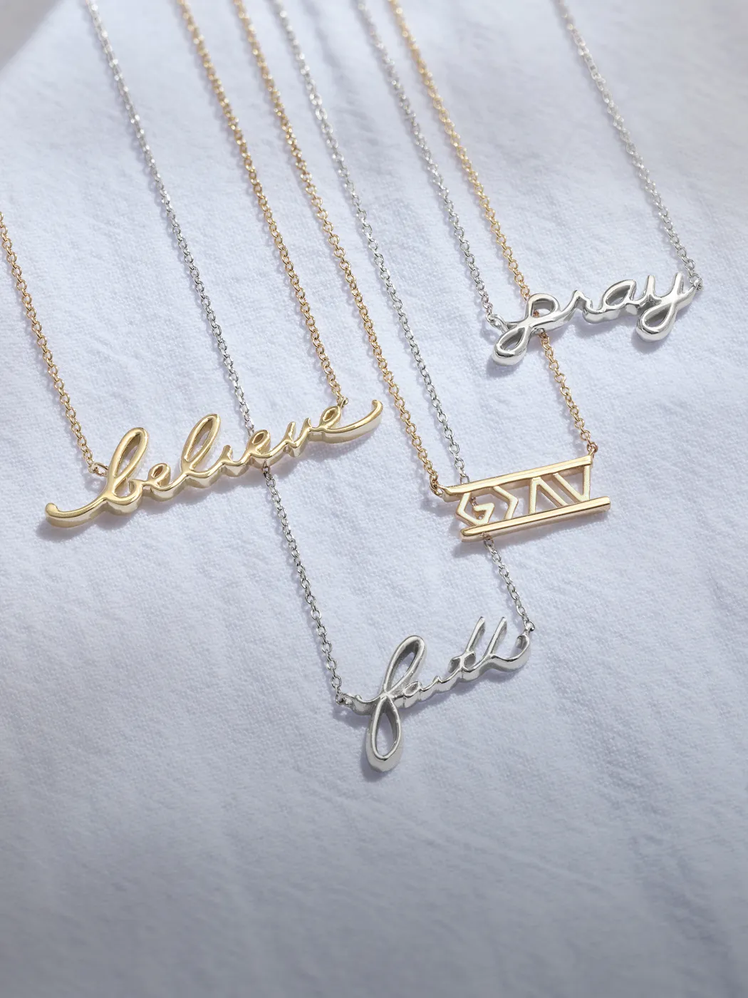 Four necklaces with words 