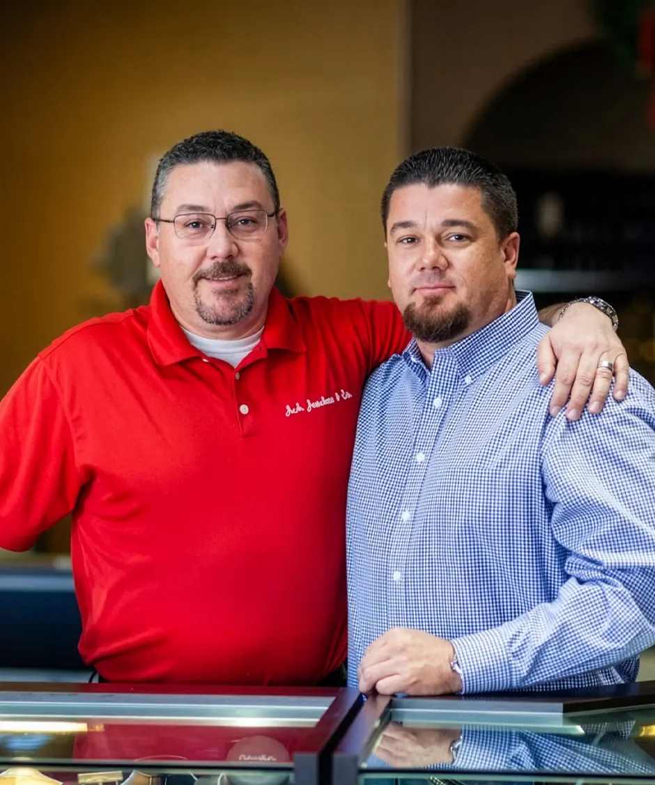 John and Adam from J.A. Jewelers & Co. posing for a photo inside their store.
