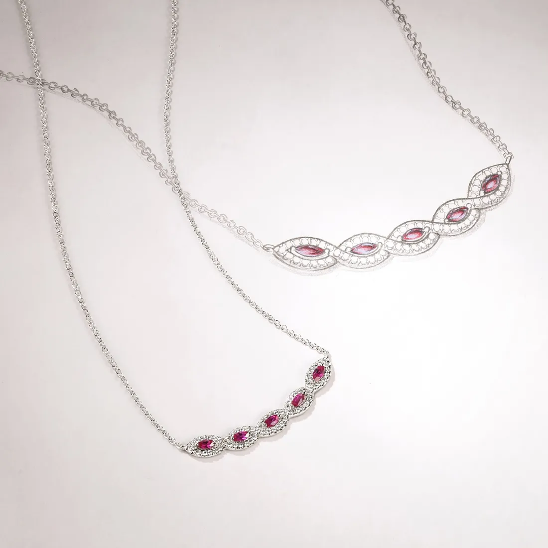 Two elegant silver necklaces featuring pink gemstones, showcasing intricate designs. Shop at J.A. Jewelers & Company, Inc.