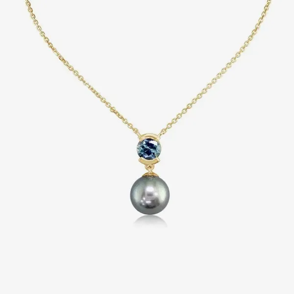 Gold necklace with a blue gemstone and a gray pearl pendant.