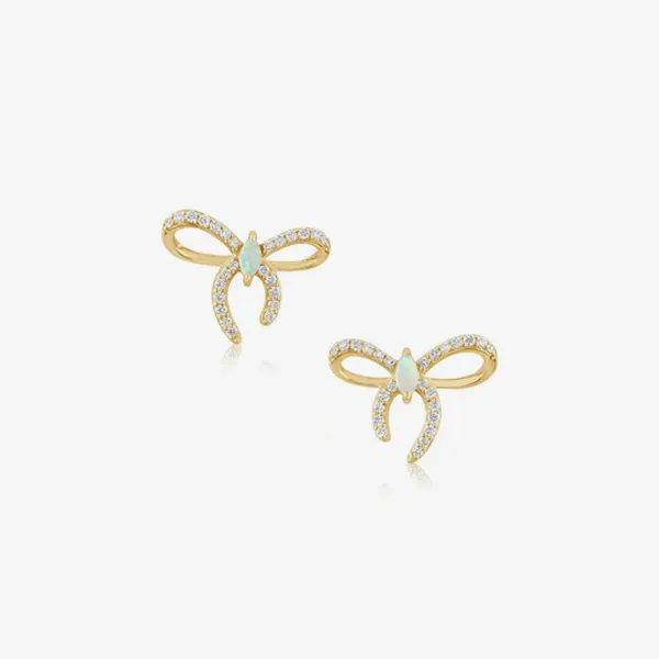 Gold bow earrings with opal and sparkling stones, available at J. Anthony Jewelers. Shop earrings now!