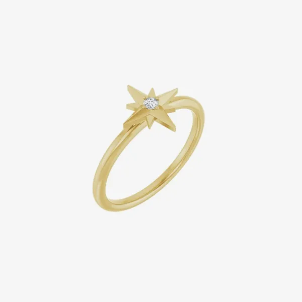 Gold star-shaped ring with a diamond center, available at J. Anthony Jewelers. Click to shop rings.