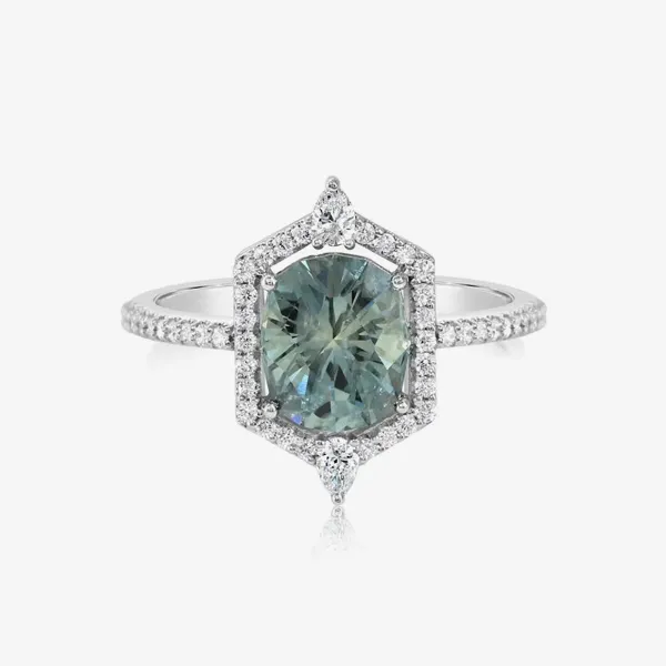Elegant ring featuring a large green gemstone surrounded by sparkling diamonds. Shop rings at J. Anthony Jewelers.