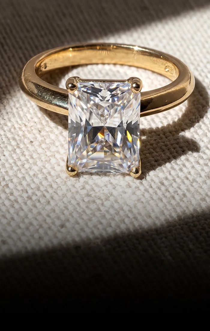 Hands adorned with multiple diamond rings and bracelets, showcasing jewelry. Explore Now.