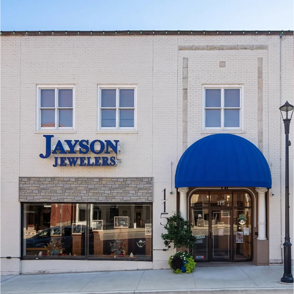 Storefront of Jayson Jewelers with cars parked outside, located in Cape Girardeau.