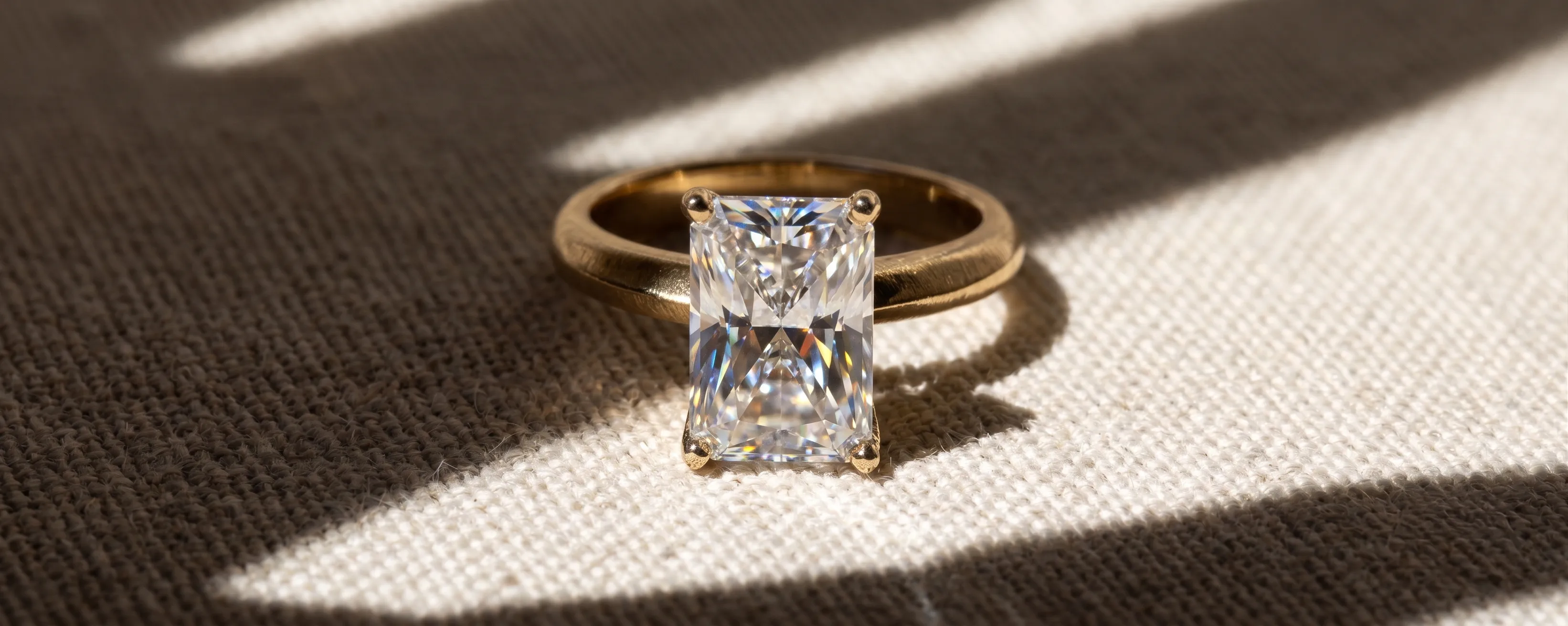 Hands adorned with multiple diamond rings and bracelets, showcasing jewelry. Explore Now.