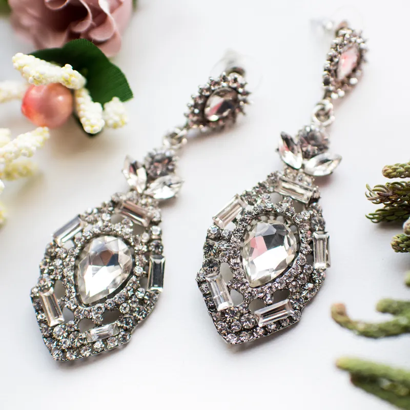 Elegant silver earrings adorned with sparkling crystals, perfect for special occasions.