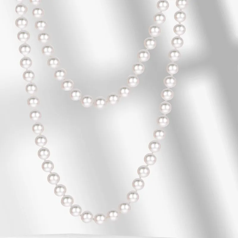 Elegant pearl necklaces displayed against a soft background.
