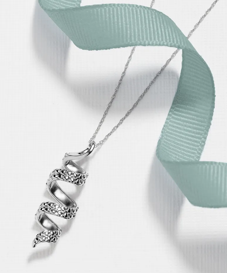 Silver spiral pendant necklace with sparkling accents, draped with a soft teal ribbon.