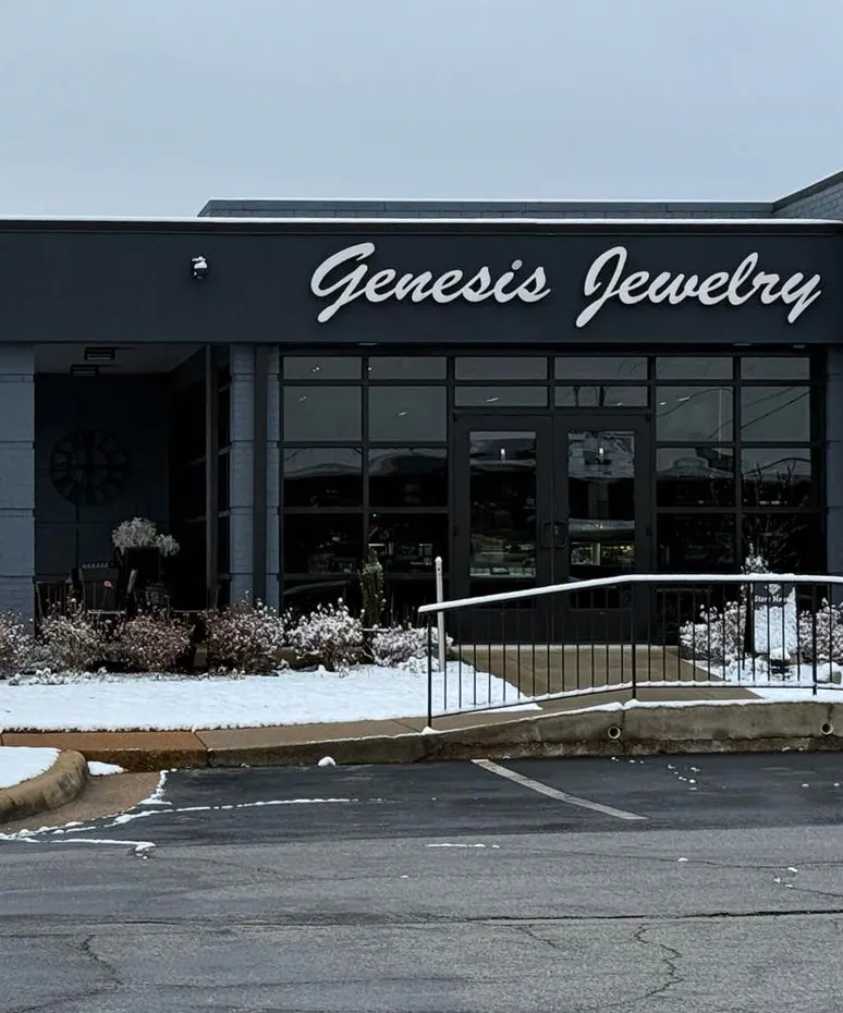 Genesis Jewelry storefront in Muscle Shoals, featuring a modern design and snowy surroundings.